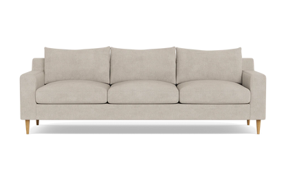 Introducing the Sloan Custom 3-Seat 95" Sofa, a stylish three-seater in beige with square armrests and wooden legs, complemented by three back cushions and three seat cushions.