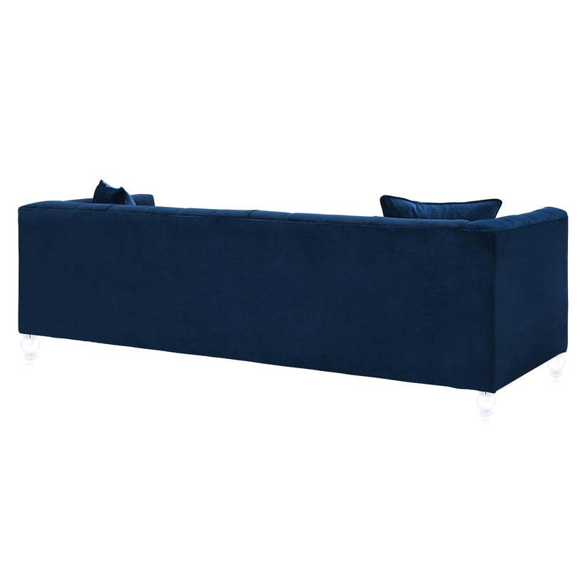Introducing the Bea Velvet Tufted Sofa - a sophisticated, elongated rectangular piece in navy blue, complete with two matching cushions. It features a tufted back and transparent legs that contribute to its elegant appearance. The rear view highlights its sleek design beautifully.