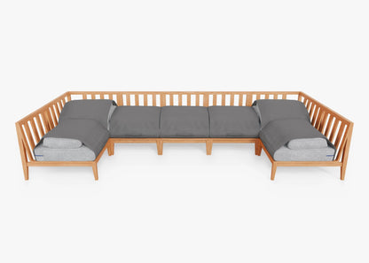 Introducing the Teak Outdoor U Sectional - Seven Seat: a spacious teak sectional sofa with slatted backrests and elegant gray cushions on a white foundation, perfect for enhancing the modern appeal of your living room or patio.