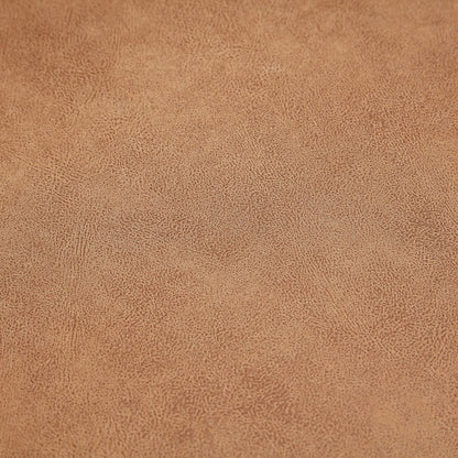 Close-up of a textured brown surface from The 5th Open 116" Left Facing Sectional. The material features a subtle, intricate pattern with small, irregular dots and lines, creating a natural, grainy appearance.