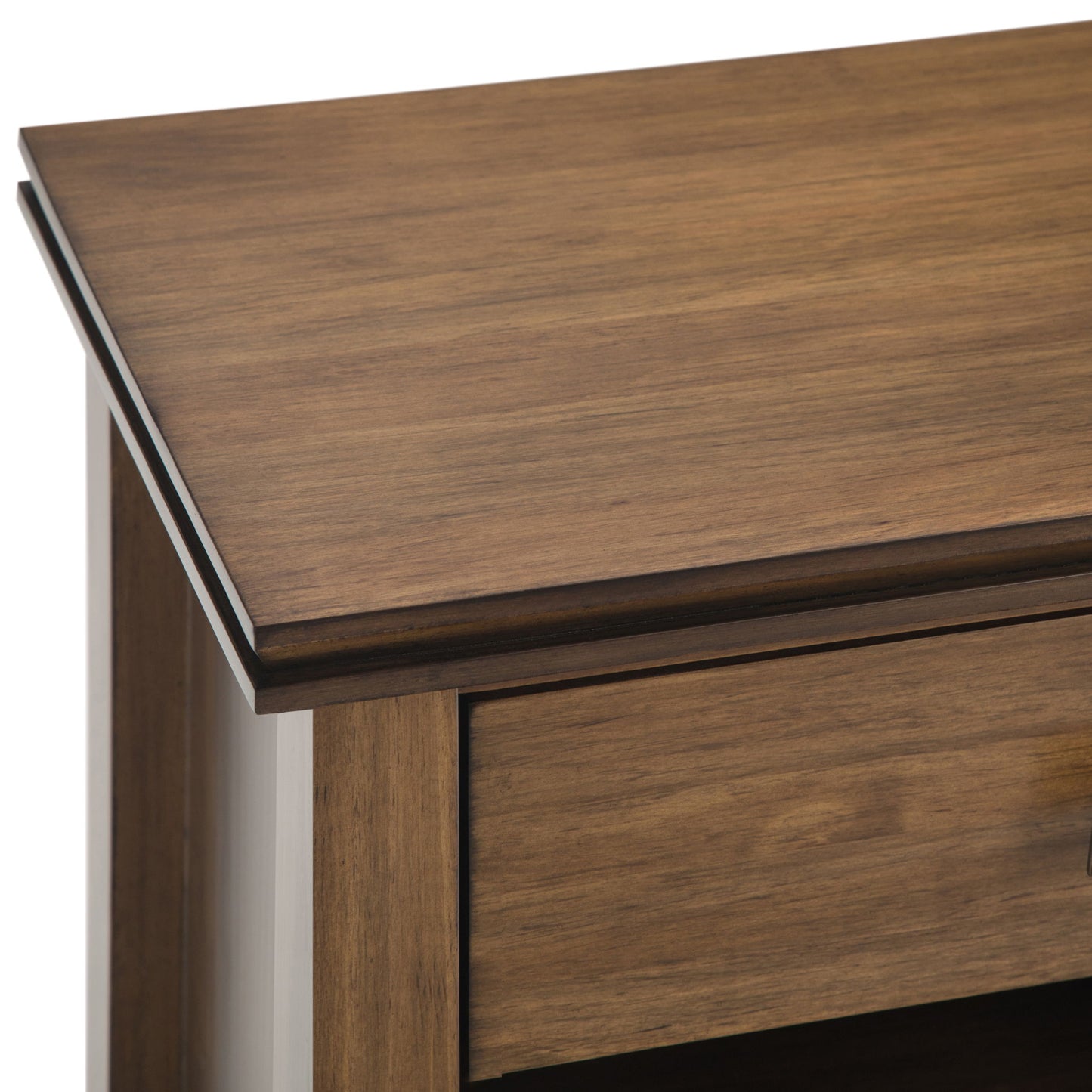 Close-up of the Artisan - Handcrafted Bedside Table corner, featuring a smooth, polished warm brown wood surface, slightly beveled edges, and a partially visible drawer below the tabletop.