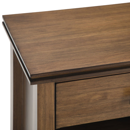 Close-up of the Artisan - Handcrafted Bedside Table corner, featuring a smooth, polished warm brown wood surface, slightly beveled edges, and a partially visible drawer below the tabletop.