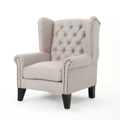 The Mid Century Modern Arm Reading Chair for Living Room features light beige tufted upholstery, studded trim, wingback design, and dark wooden legs, set against a plain white background.