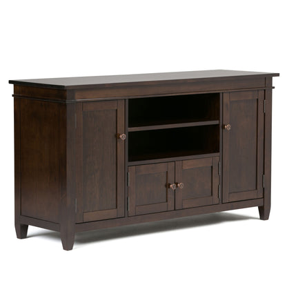 The Carlton TV Media Stand features a dark brown wood finish, two end cabinets, central shelves, two small drawers beneath, simple metal knobs, and clean classic lines.