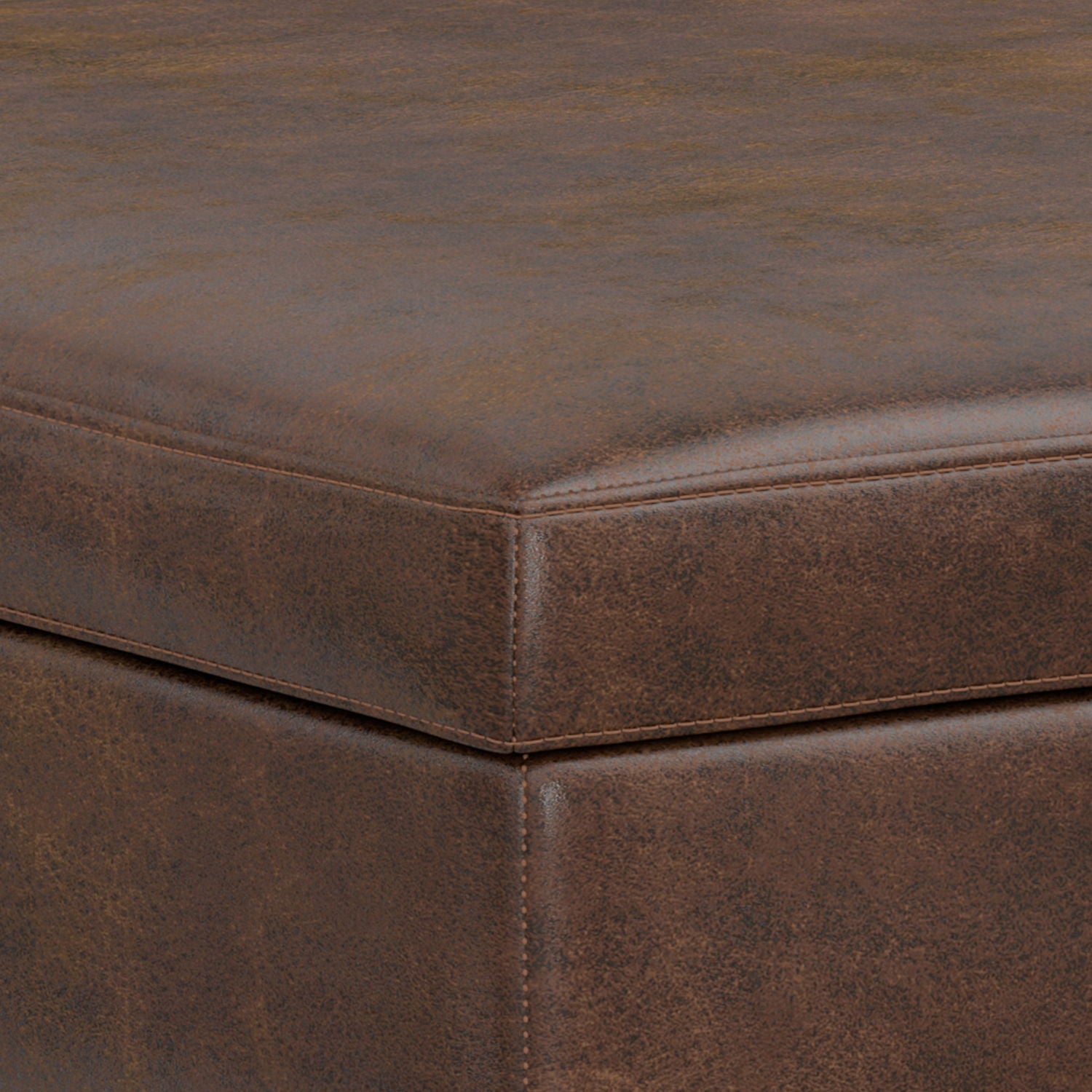 Close-up of the top corner of the Owen Multifunctional Square Coffee Table Storage Ottoman, highlighting its brown, leather-like upholstery with visible stitching and a slightly textured surface.