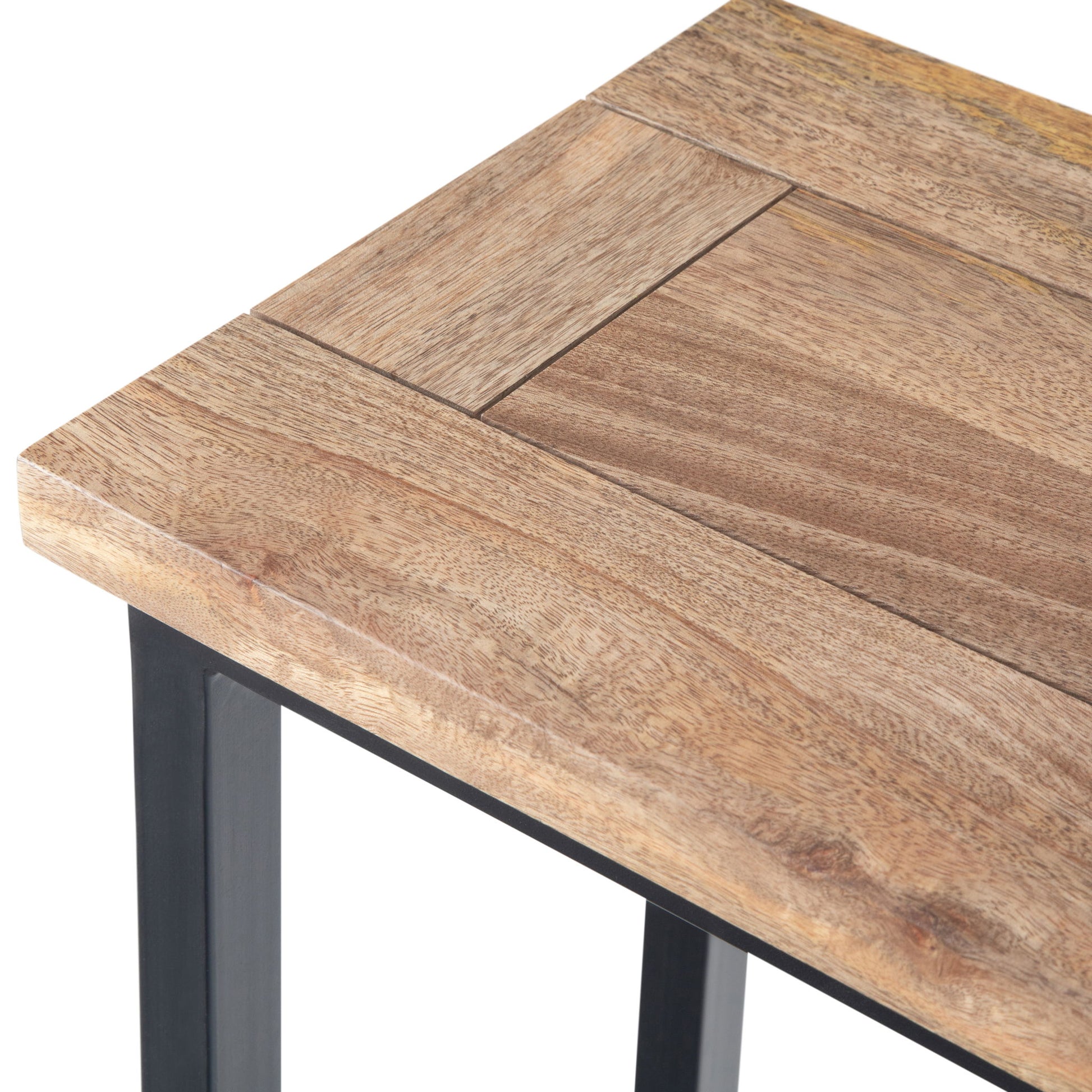 Close-up of the Skyler - C Side Handcrafted Table corner, featuring a light natural wood finish, visible wood grain, rectangular tabletop pattern, and a sturdy black metal frame.
