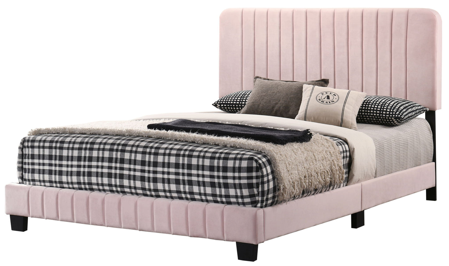 The Lodi - Bed features a tall, light pink upholstered headboard and frame, styled with black and white plaid bedding, a beige throw blanket, and several neutral-toned decorative pillows for a modern touch.