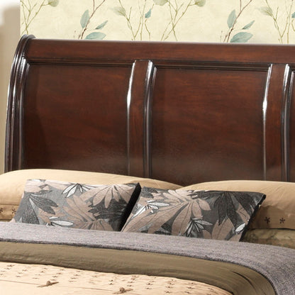 A close-up of the LaVita - Storage Bed with a wooden sleigh-style headboard, beige bedding, two leafy-patterned pillows, and leafy wallpaper in the background.