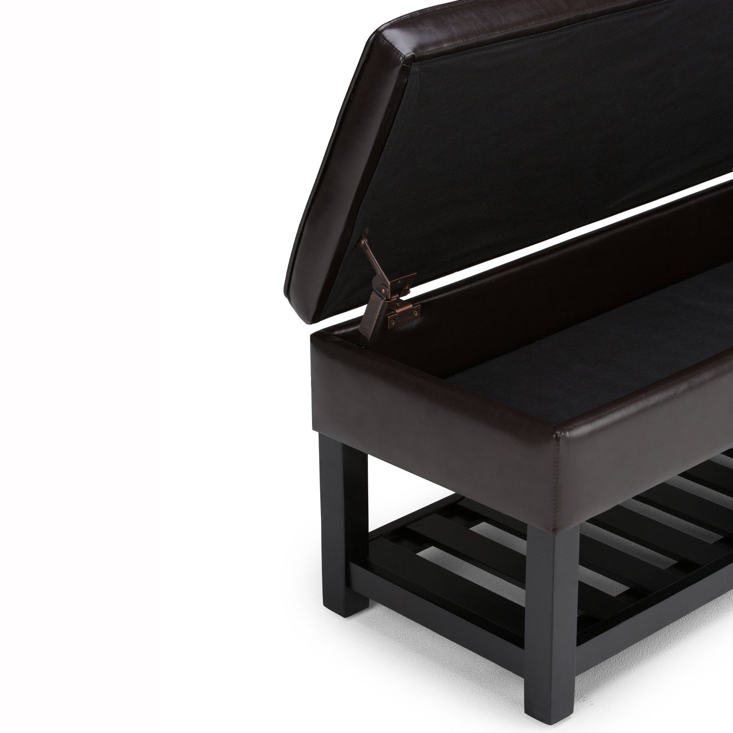 The Cosmopolitan Storage Ottoman Bench With Open Bottom in Tanners Brown features a cushioned lid that opens to reveal an empty storage compartment, sturdy black legs, and a slatted lower shelf.