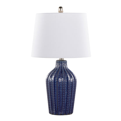 The Rockwell - Contemporary Table Lamp (Set of 2) features a textured dark blue ceramic base with vertical patterns and a white tapered fabric shade.