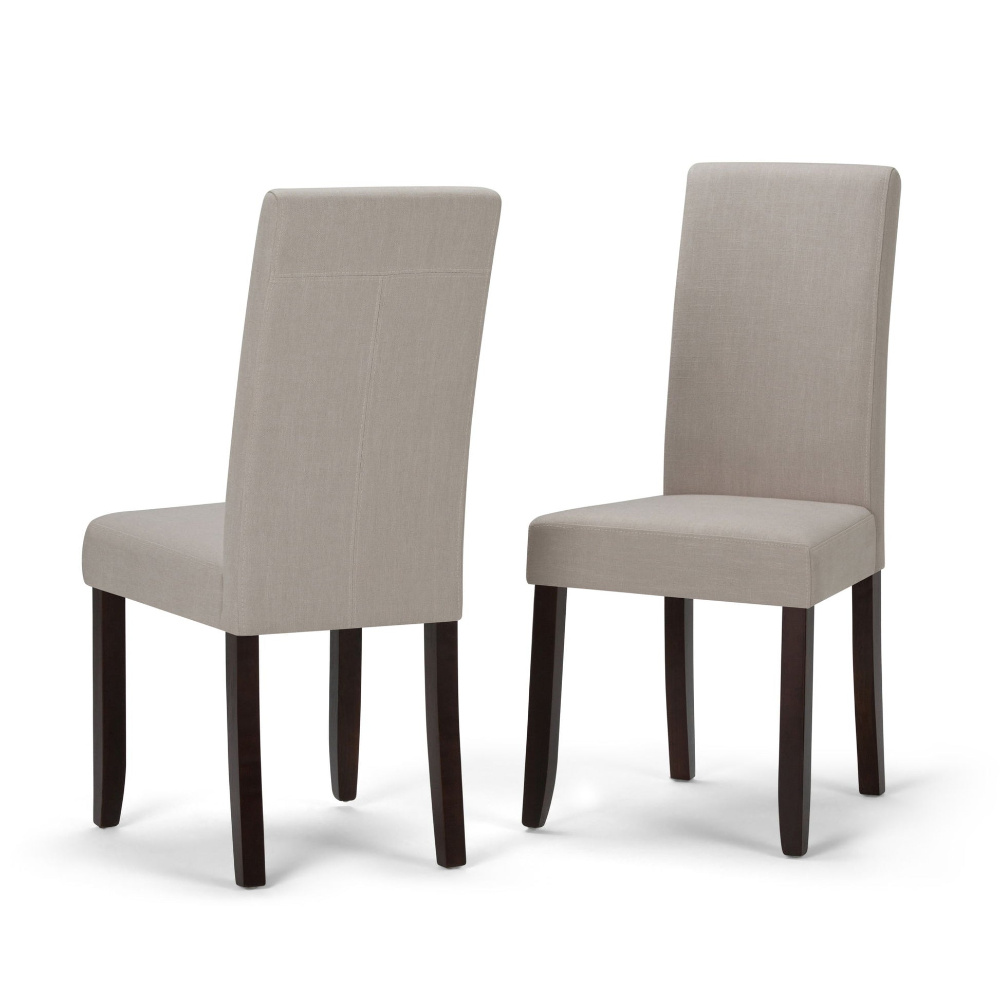 The Acadian Upholstered Parson Dining Chair set includes two chairs with light beige fabric seats and backs and four dark wooden legs. One chair is shown facing forward, the other angled to display the back design.