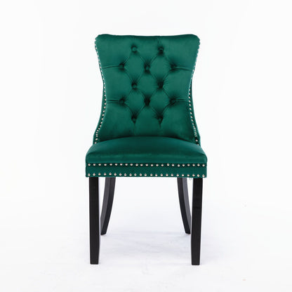 The Nikki set includes two modern, high-end velvet-upholstered dining chairs with a tufted back, silver nailhead trim, and solid wood legs, shown against a plain white background.