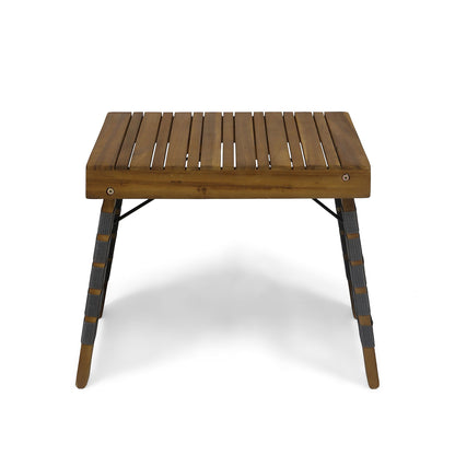 The Outdoor Wooden Foldable Side Table - Teak features slatted wood, four angled legs with wrapped detailing and metal braces for support, and is shown on a white background.