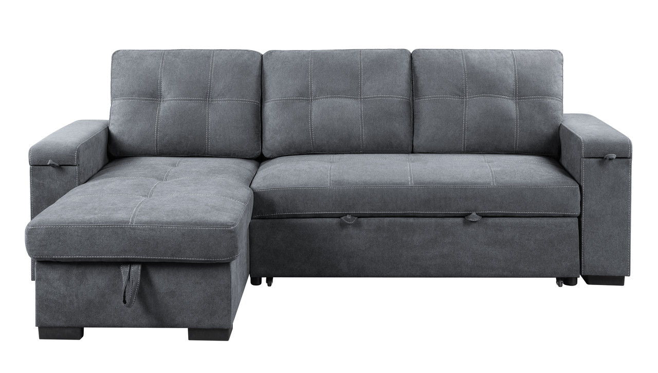 The Toby Reversible Sleeper Sectional Sofa in gray features a woven fabric, storage chaise, cup holder, charging ports, and pockets, with three back cushions and visible stitching, shown against a white background.