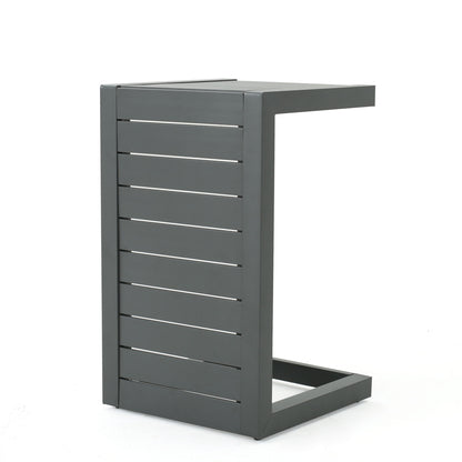 The Aluminum Outdoor C-Shaped Side Table for Patio features a modern, rectangular, dark gray metal design with slatted sides and an open base, shown against a plain white background.