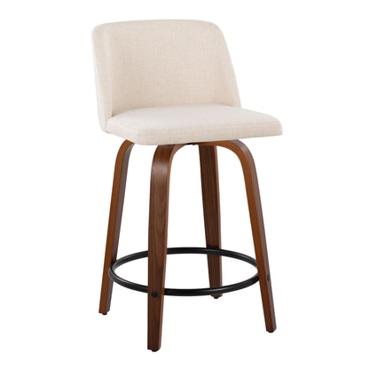 The Toriano set includes two mid-century modern counter stools, each featuring a cushioned cream seat and backrest, a black round footrest, and four curved wooden legs for a sleek appearance.