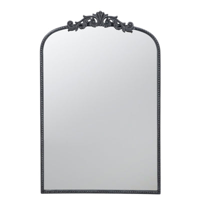 The Arch Mirror is a baroque-inspired wall decor piece for the bathroom, bedroom, or living room. It features a rectangular shape with rounded top corners, an ornate black decorative frame, and intricate detailing at the top center.