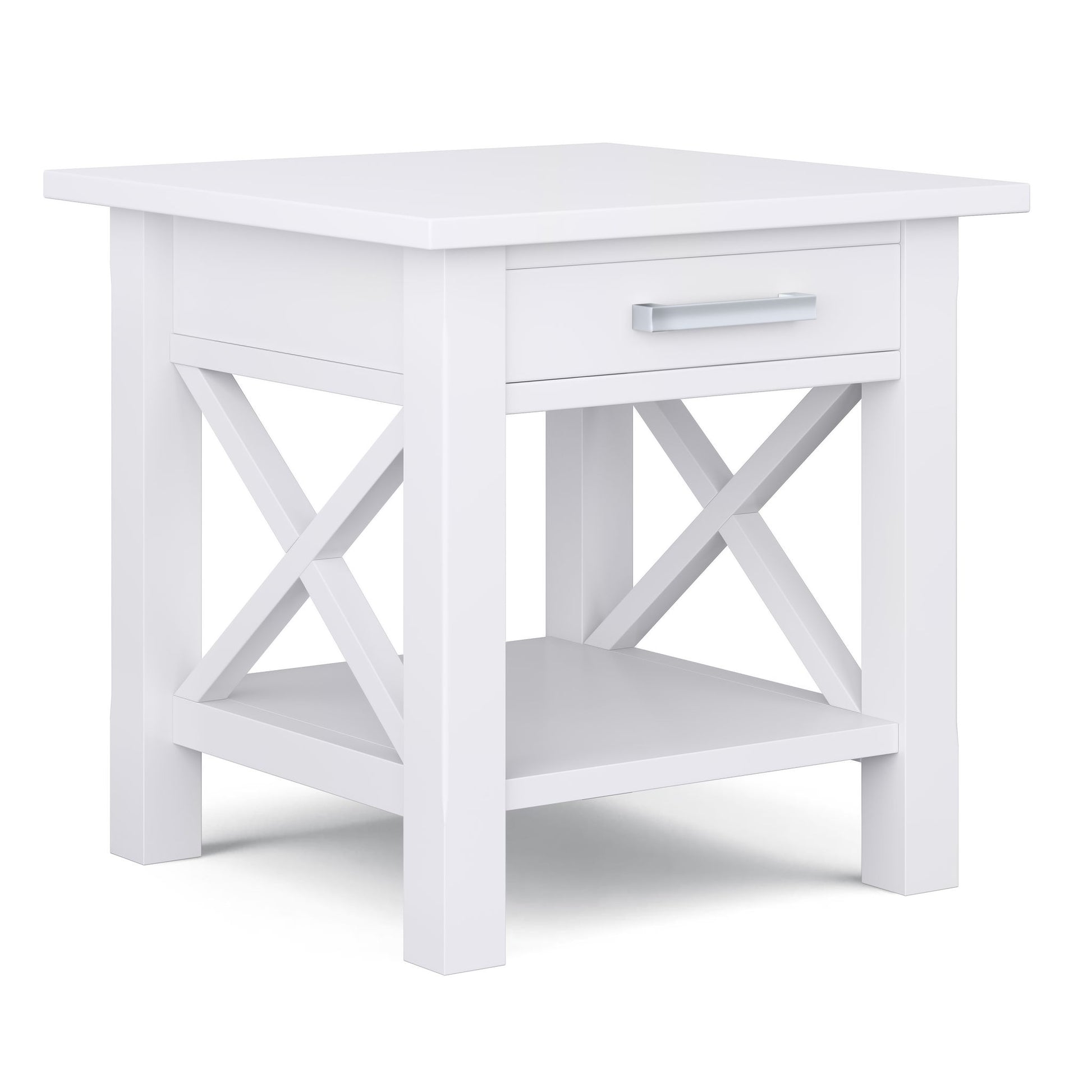The Kitchener - Handcrafted Table is a white wooden end table featuring an X-shaped side design, one drawer with a silver handle, and an open lower shelf.