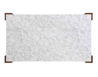 The Hettie Dining Table features a rectangular engineered stone top in white with subtle grey veining, accented by four small brown wooden corners, shown from above against a white background.