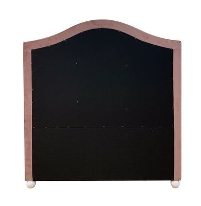 The Reggie Twin Bed features a fabric-covered headboard with a curved top, a black central panel framed in light pink, and stands on two small round white feet.