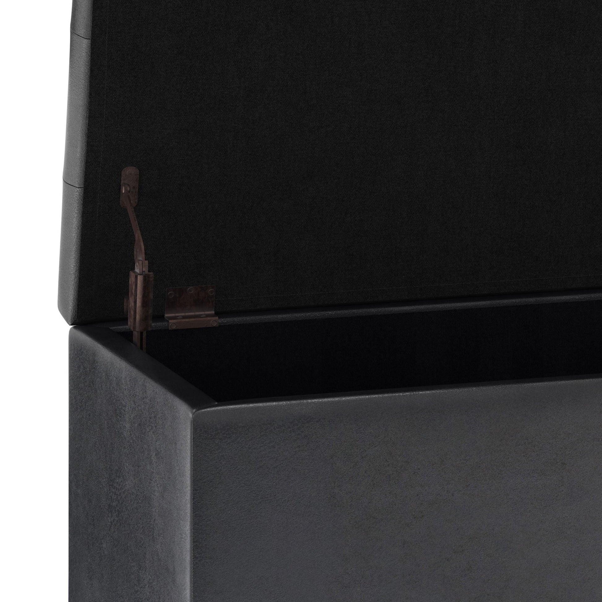 A close-up view of the open Cosmopolitan Upholstered Storage Ottoman reveals its black interior and hinge mechanism inside the lid.