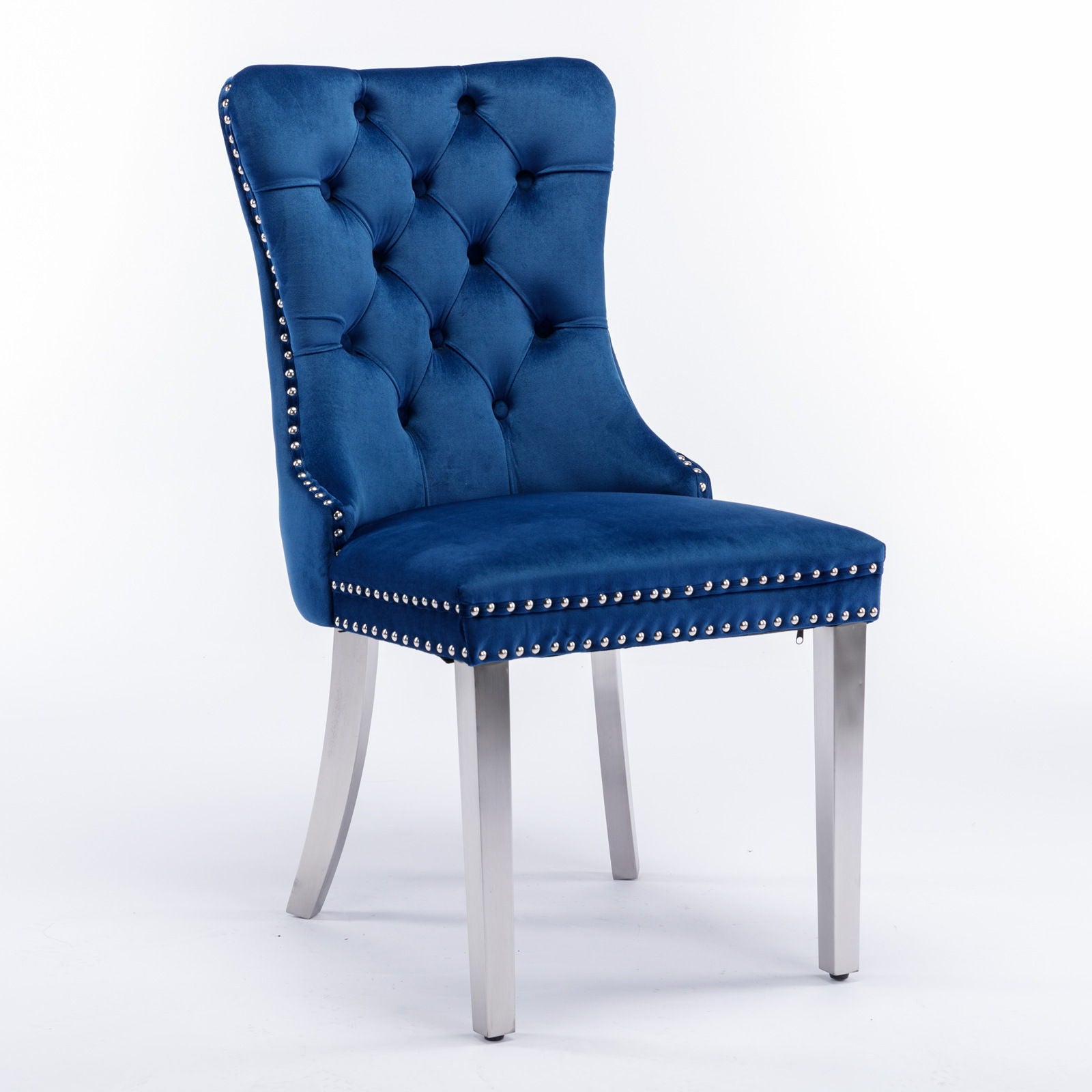 The Nikki chair is a modern, high-end velvet upholstered dining chair with tufted back, chrome stainless steel legs, and nailhead trim. Set of 2. Shown against a plain white background.