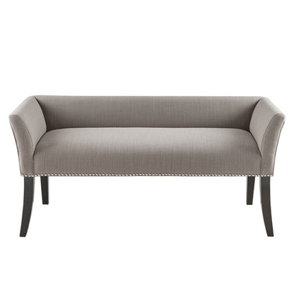 The Elegant Design Bench features modern gray upholstery, a low back, curved arms, nailhead trim on the base, and four dark solid wood legs.