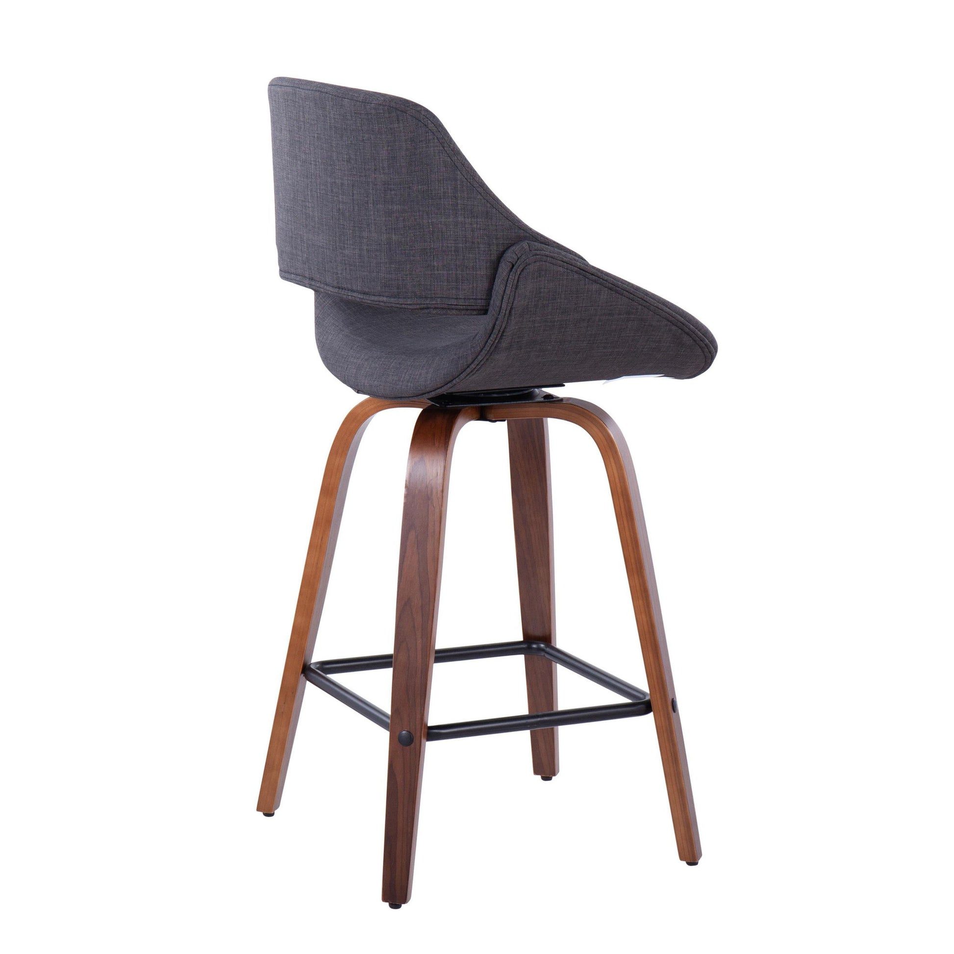 The Fabrico Mid-Century Modern Counter Stool (Set of 2) features a curved, dark gray upholstered seat, wooden legs, and a metal footrest, displayed against a plain white background.