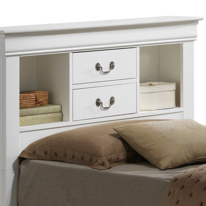The Louis Phillipe Bookcase Storage Bed features a white wooden headboard with two central drawers, side shelves for books and decor, and comes complete with pillows and bedding displayed on the bed.