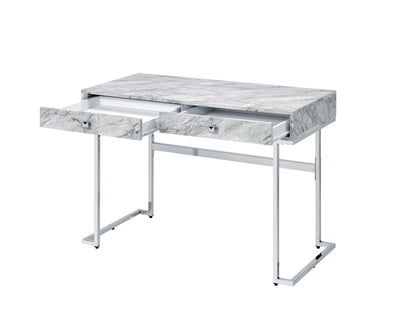 The Tigress Printed Faux Marble Top Writing Desk in white features a marble-patterned surface, two open drawers, and a minimalist white metal frame.