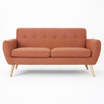 The Modern Loveseat Sofa With Button Tufted Backrest features orange upholstery, two seat cushions, button-tufted backrest, and angled wooden legs, displayed against a plain white background.