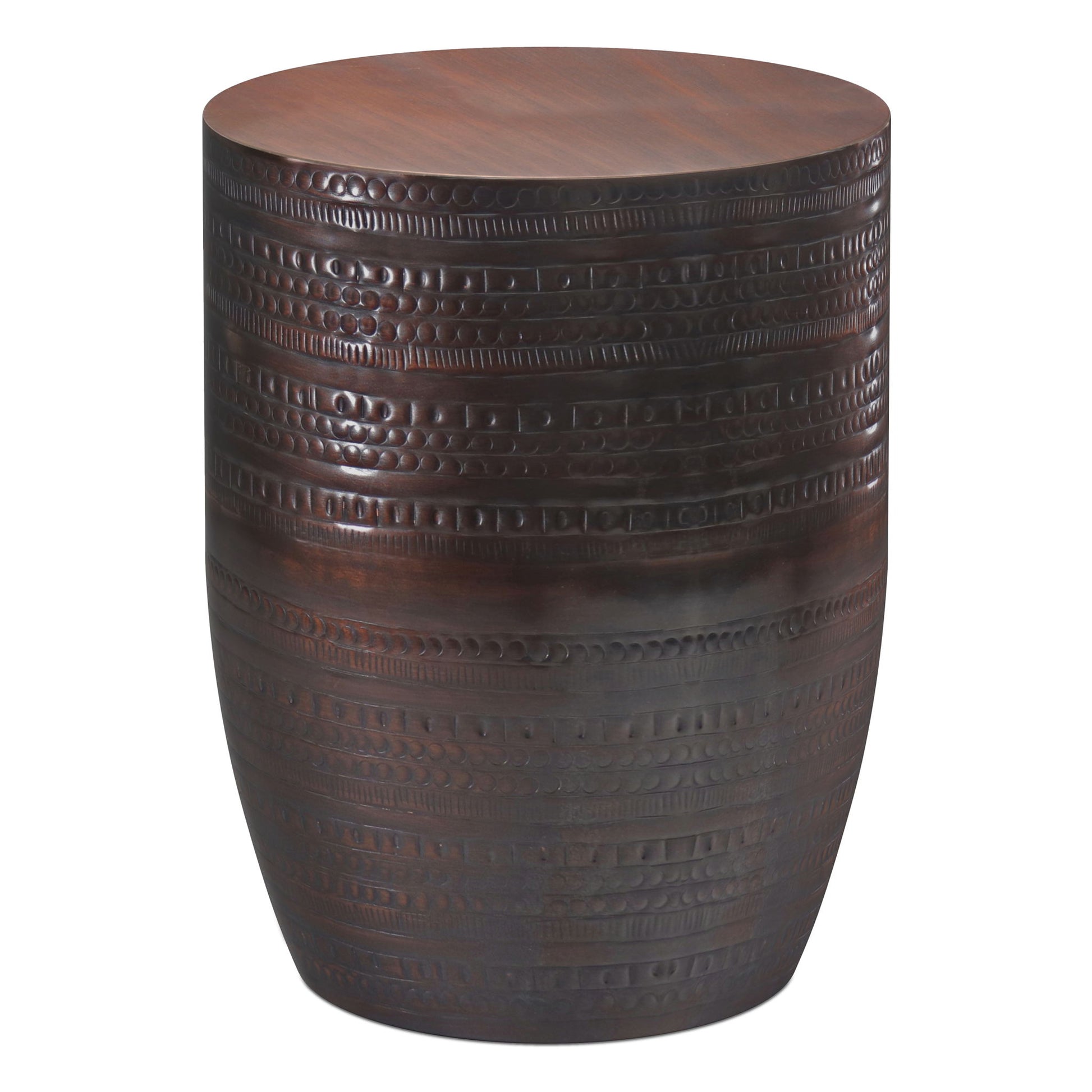 The Johnsen Handcrafted Large Metal Accent Table features a round shape, a smooth top, and textured, carved horizontal patterns around the sides.