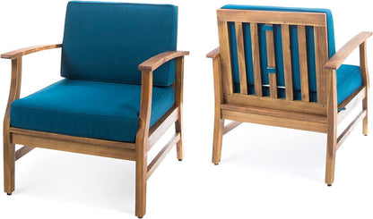 Two Perla Contemporary Club Chairs, each with water-resistant blue seat and back cushions; one is shown from the front, the other from the back, showcasing their slatted wooden frames and armrests.