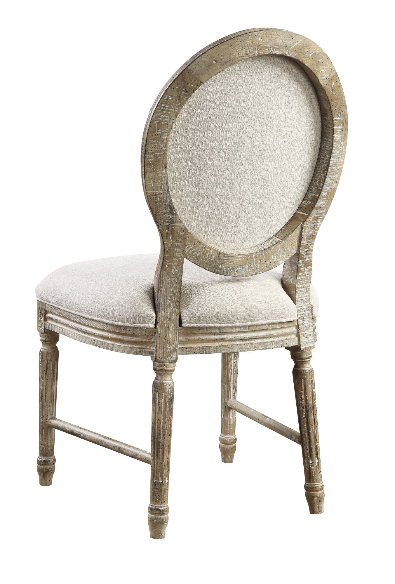 The Ludin Upholstered Dining Chairs (Set of 2) feature a wooden frame with round, cushioned backs and seats in light beige fabric, carved legs, and a rustic brown weathered finish.