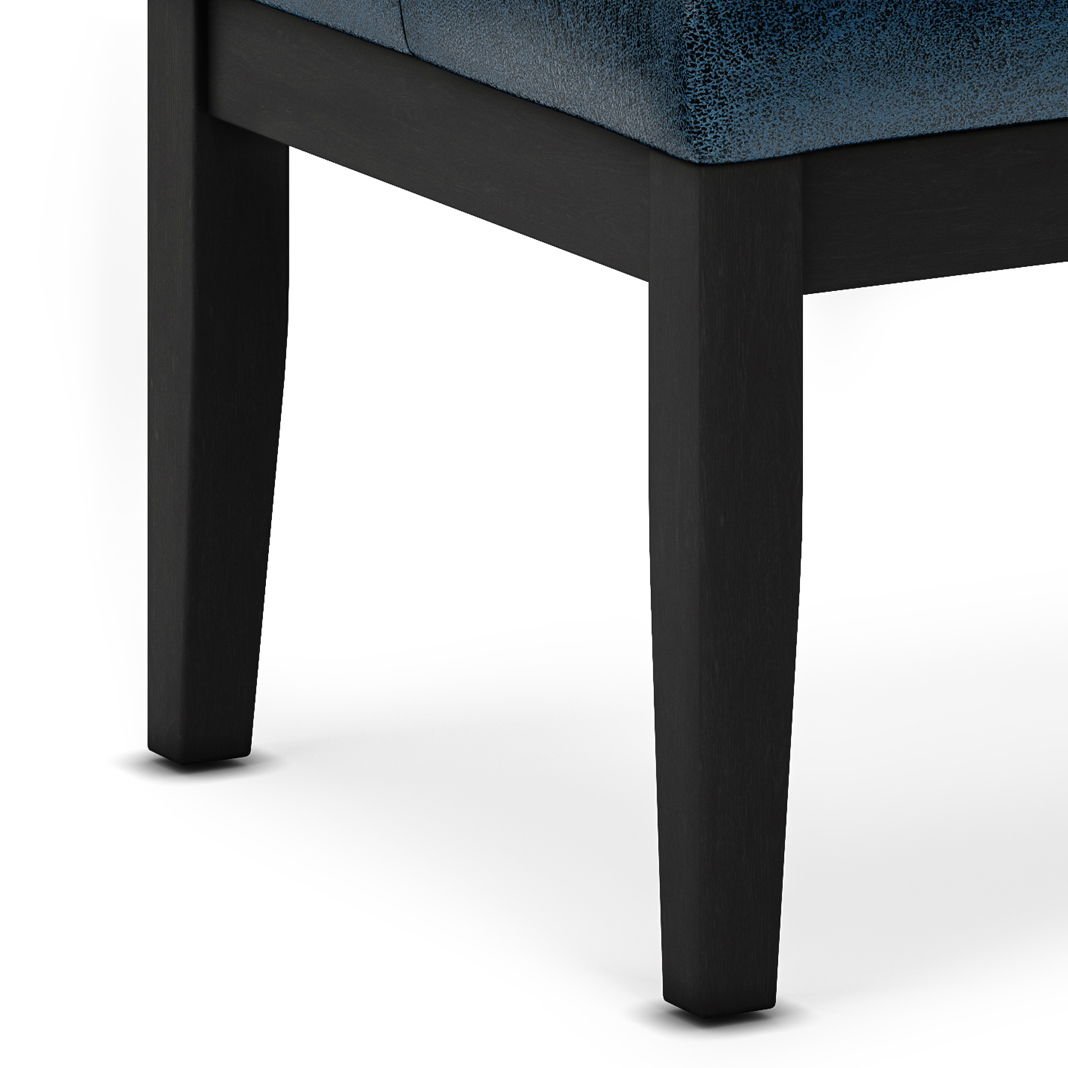 Close-up of the legs of the Lacey - Upholstered Tufted Ottoman Bench, featuring dark wood and a dark blue textured seat, set against a plain white background.