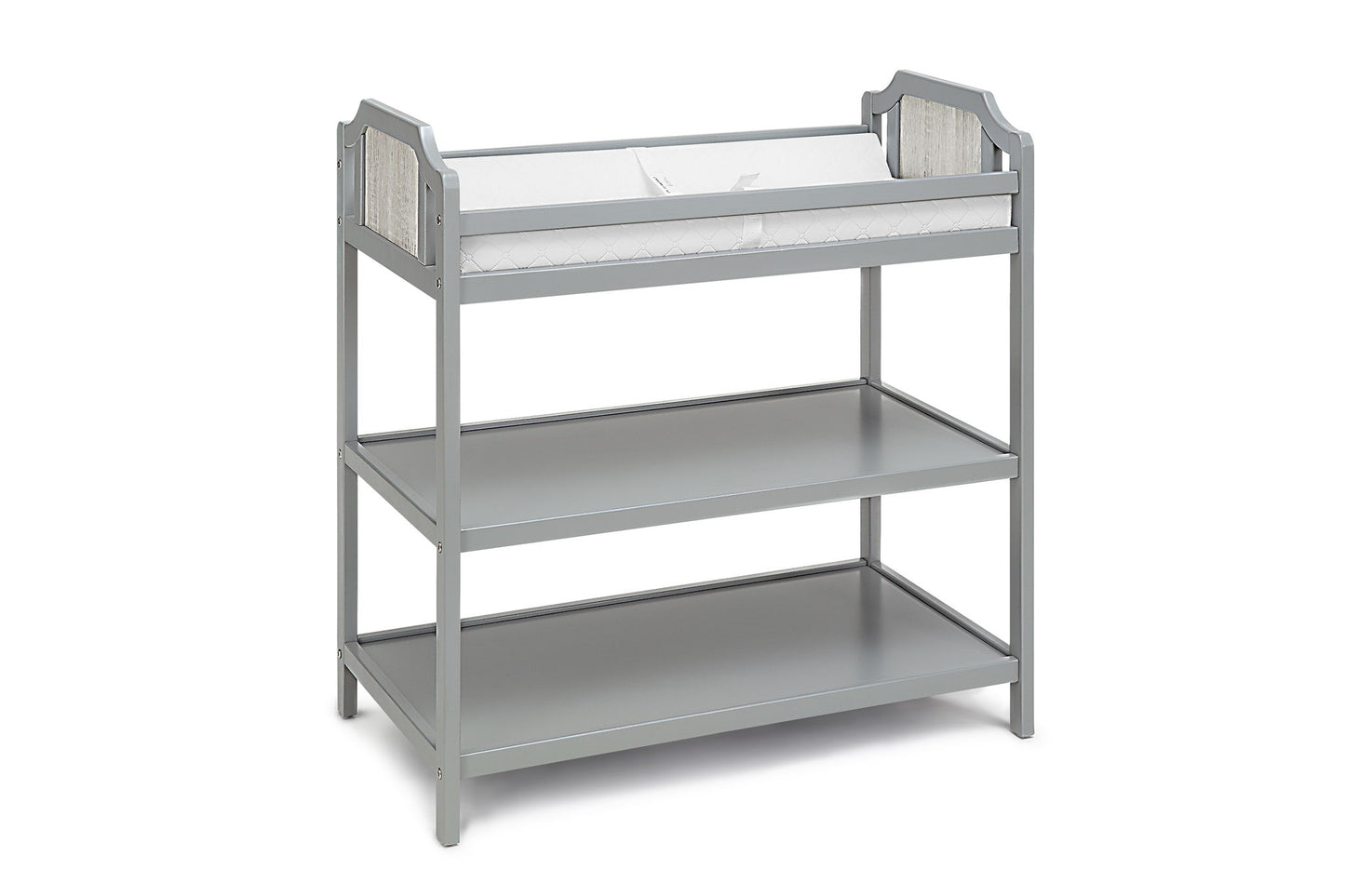 The Brees - Changing Table features a gray wooden design with decorative side paneling, two open shelves for storage, and a white cushioned changing pad on top.