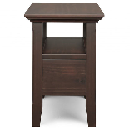The Acadian Narrow Side Table With Drawer in brown features a rectangular top, open middle shelf, lower drawer, and a simple modern design with straight legs and clean lines.