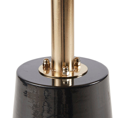 A close-up of the Accent Table Elegant Design Metal Round - Black / Gold shows its smooth, glossy black base with a shiny gold metal rod and four rounded gold bolts securing the rod to the base.