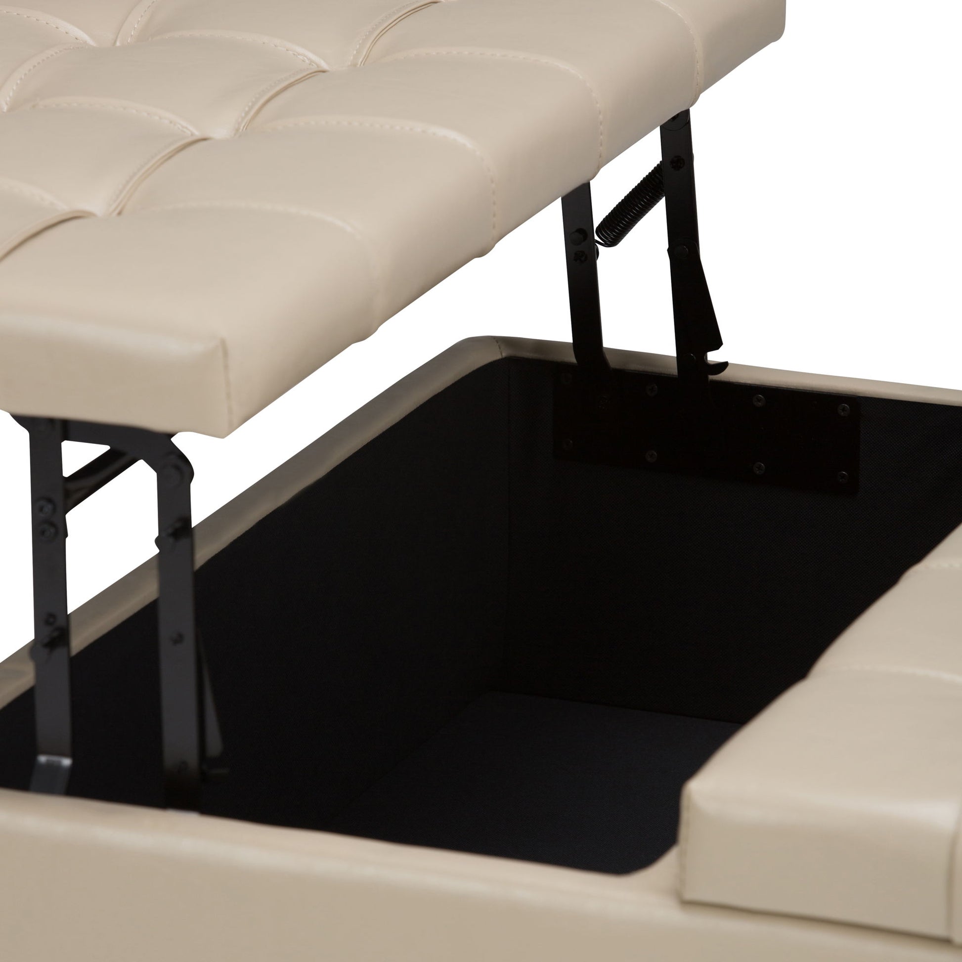 A close-up of the Harrison - Upholstered Coffee Table Storage Ottoman in beige shows its tufted, cushioned lid partially open to reveal a spacious, black-lined storage compartment inside.