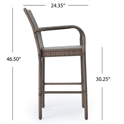 The Outdoor Wicker Barstool with rattan and iron frame features armrests, a backrest, four legs with a footrest, and measures 46.5" high, 30.25" seat height, and 24.35" wide in brown wicker.