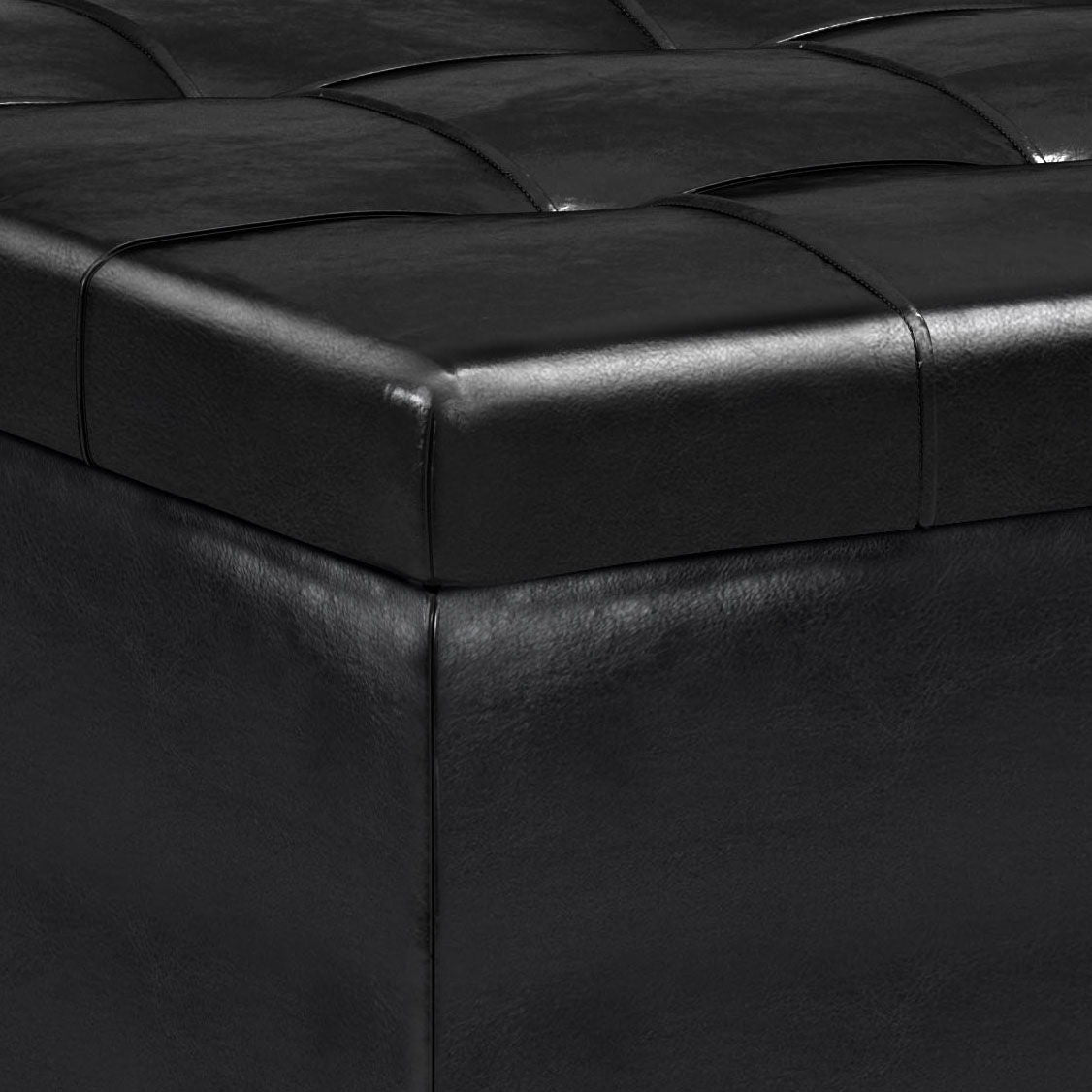A close-up of the Harrison Upholstered Coffee Table Storage Ottoman in black leather.