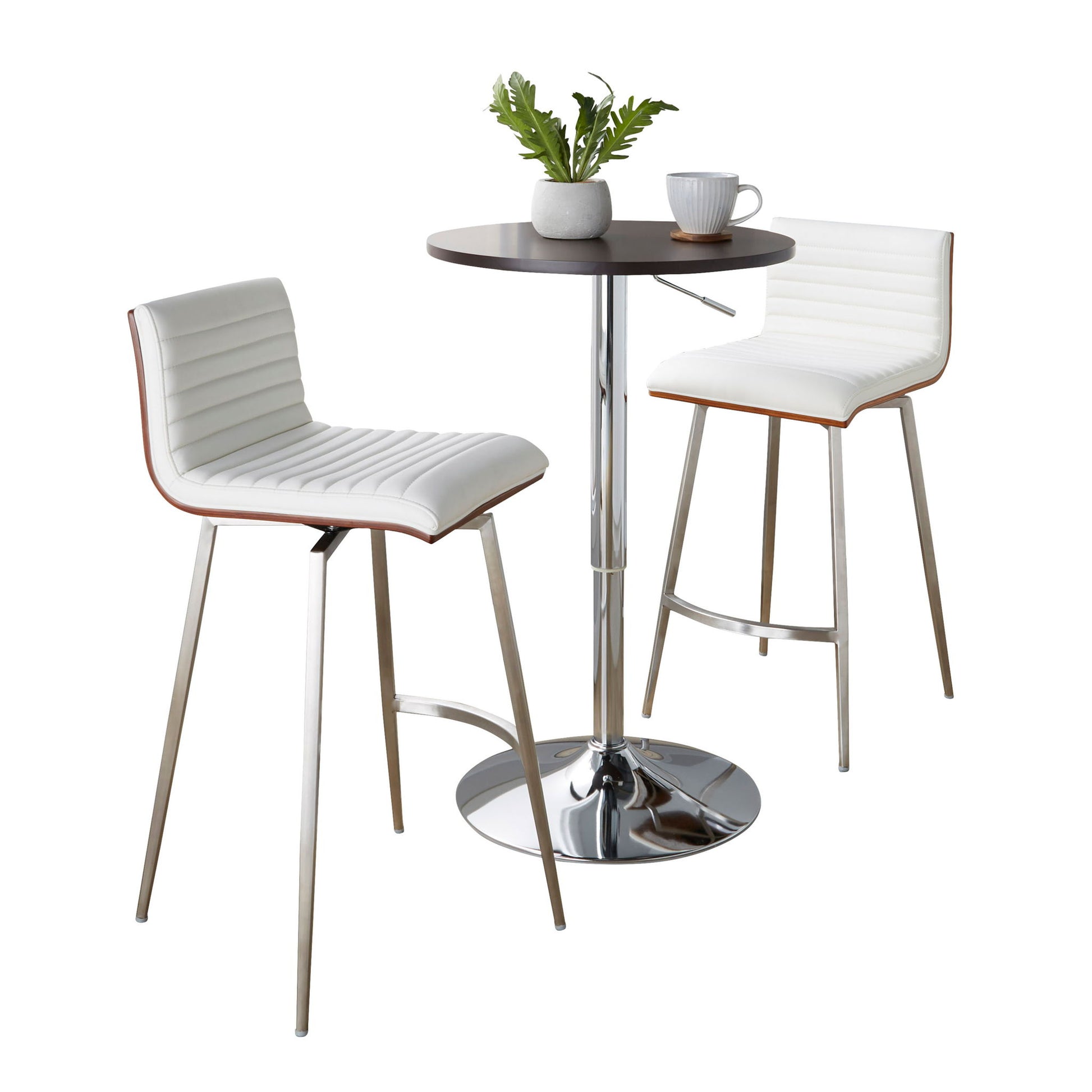 The Mason 3 Piece Swivel Mid Century Modern Counter Height Dining Set features a round dark tabletop with a chrome stand and two white padded bar stools with chrome legs, shown styled with a plant, mug, and plate.