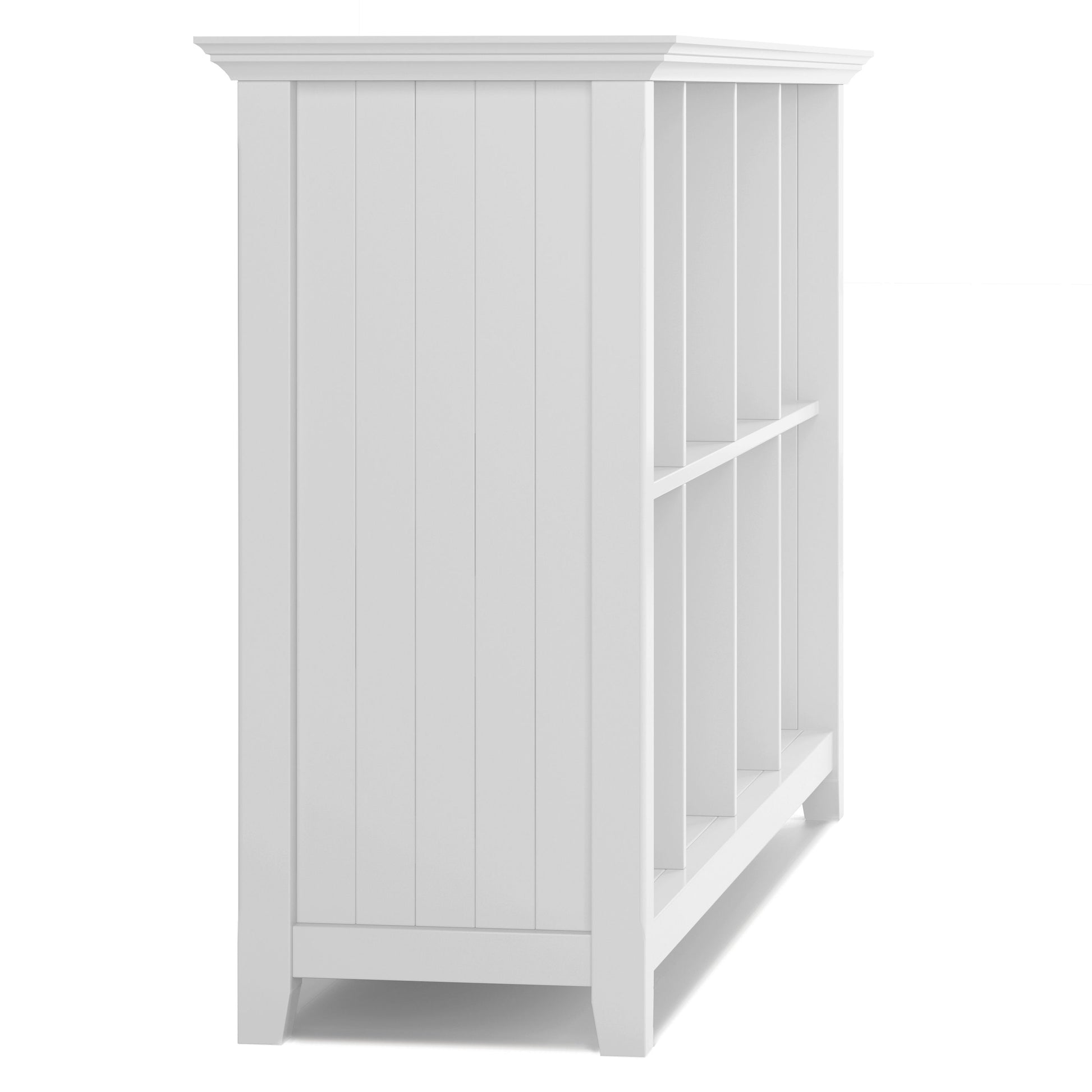 The Acadian - Handcrafted Cube Storage is a white wooden bookshelf with six open compartments, a paneled side, a clean and simple design, and short legs.
