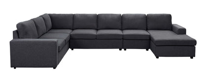 The Hayden - Linen 7 Seat Reversible Modular Sectional Sofa Chaise is a large, dark gray L-shaped sofa with cushions and a right-side chaise lounge, shown against a white background.