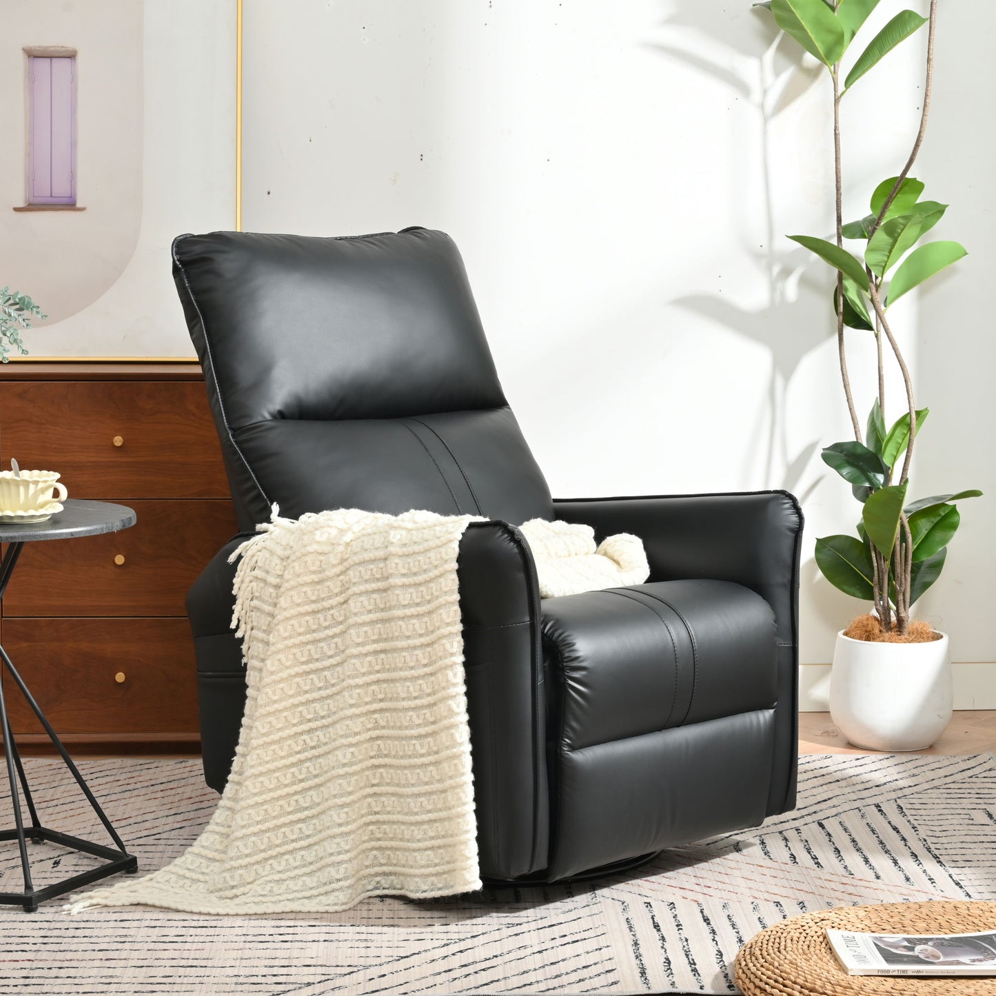 A 360° Modern Small Rocking Swivel Recliner Chair With Side Pocket, draped with a cream textured blanket, sits on a patterned rug near a potted plant and sunlight, with a small side table and wooden dresser nearby.