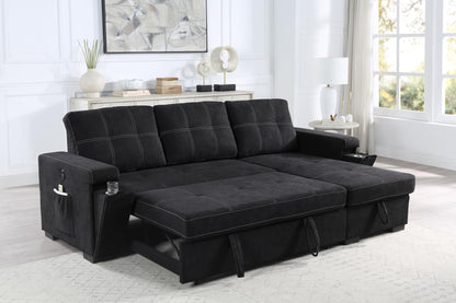 The Toby reversible sleeper sectional sofa in black woven fabric features white stitching, cup holders, storage chaise, charging ports, and pockets. It sits in a bright living room with large windows, a white rug, and a sideboard decorated with lamps and art.