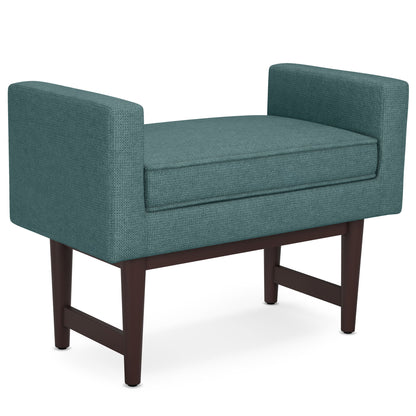 The Scott - Upholstered Ottoman Bench features a modern rectangular design with a teal upholstered seat, armrests, and dark wooden legs.