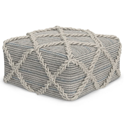 The Cowan Handcrafted Square Pouf is a rectangular ottoman in gray and white stripes, featuring thick rope accents in a diamond pattern along the top and sides.