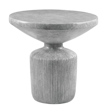The Laddie - Weathered Table is a modern gray concrete side table with a round, wide top and ribbed cylindrical base, featuring a sculptural minimalist design and smooth tabletop finish.