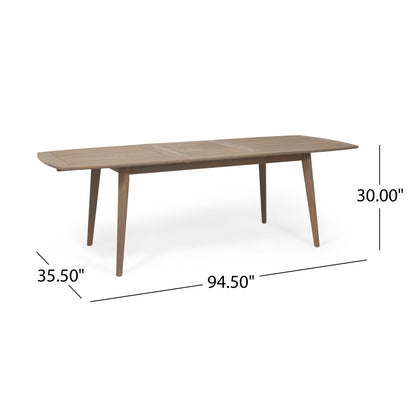 The Placidity Outdoor Expandable Dining Table features a slatted tabletop and tapered legs, measuring 94.5"L x 35.5"W x 30"H—perfect for stylish outdoor dining.